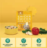 Two bags of Chicka Chicka Bow Wow dog food with kibble, bone broth, fresh apple slices, and spinach displayed on yellow backg