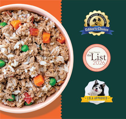 Pink bowl filled with ground turkey and rice mixed with diced red, orange, and green vegetables.
