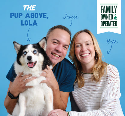 Two people and a black and white husky dog on blue background with "The Pup Above, Lola" and "Family Owned & Operated" text.