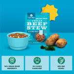 Turquoise package of grain-free Texas beef stew with bone broth, shown with prepared stew in bowl, potatoes, and parsley on b